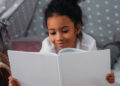 Early-initiated reading for pleasure linked to better cognitive performance and mental well-being in young adolescence