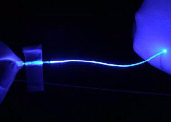 Soft optical fibers block pain while moving and stretching with the body