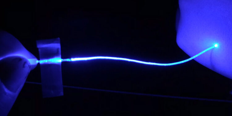 Soft optical fibers block pain while moving and stretching with the body